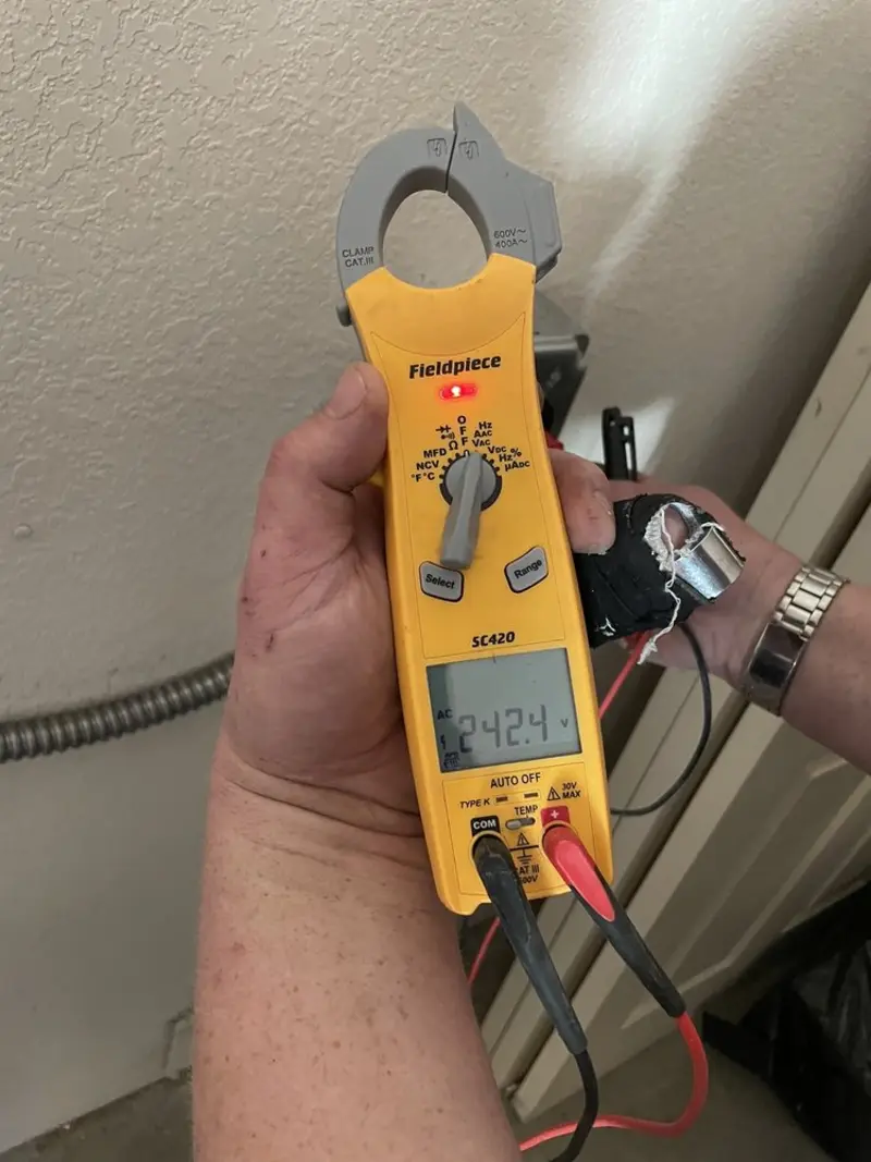Voltage testing with clamp meter during Generator Installation in Denham Springs